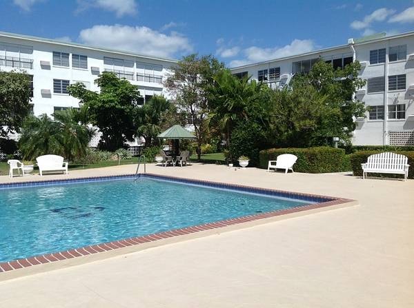 Jansel Court pool and building exterior by day